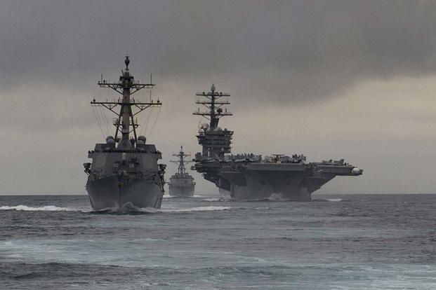 In this file photo, ships of the Nimitz Carrier Strike Group steam together during training in March. (U.S. Navy/MC3 Craig Z. Rodarte)