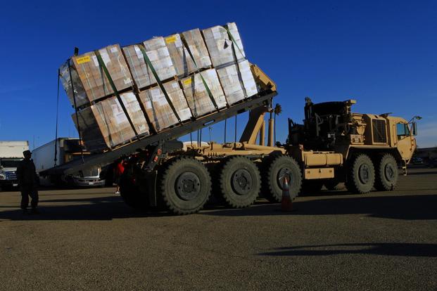 FILE PHOTO -- U.S. Army National Guard Soldiers load pallets of food onto a palletized loading system Thurs., Dec. 7, 2017, at Joint Forces Training Base Los Alamitos, California. (U.S. Air National Guard/Senior Airman Crystal Housman)