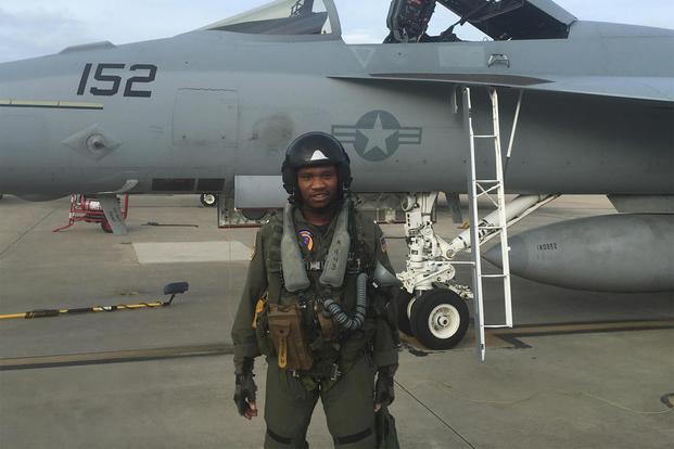 Courtland Savage posing with an F/A-18 while training at VFA-106. (Courtesy Courtland Savage)