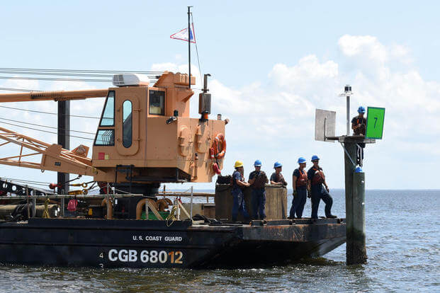 Crew members from Coast Guard Cutter Vise, a construction tender based in St. Petersburg, Fla., repair a navigation aid near Tampa Bay, Sept. 12, 2017. Coast Guard Crews from the Tampa area evaluated the condition of the port and rebuilt damaged navigation markers in order to reopen the port to traffic. (Coast Guard photo/Steve Strohmaier)