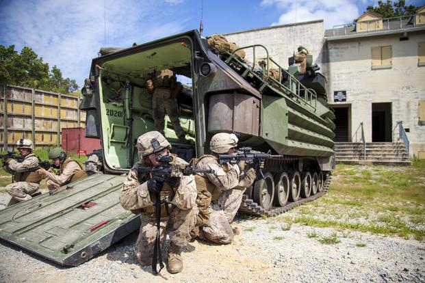 Marines assigned to Battalion Landing Team (BLT) 3/2, 26th Marine Expeditionary Unit (MEU), provide security during a direct action raid from an amphibious assault vehicle at Fort Pickett, Va., Sept. 8, 2012. (U.S. Marines/