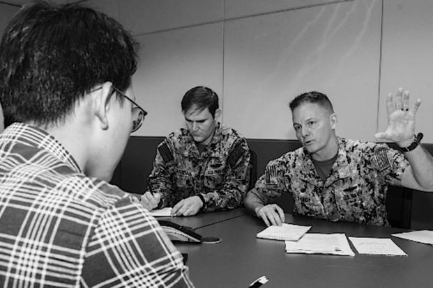 Rear Adm. Joey Tynch, commander, Task Force 73, explains the importance of maritime domain awareness during a media interview for Southeast Asia Cooperation and Training (SEACAT). 