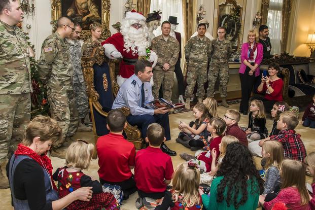 The Adjutant General of Colorado U.S. Air Force Maj. Gen. Mike Loh reads a holiday storybook, Dec. 13, 2017, at the Governor's Residence, to children of deployed Colorado National Guard members. ((U.S. Air National Guard/Maj. Darin Overstreet)