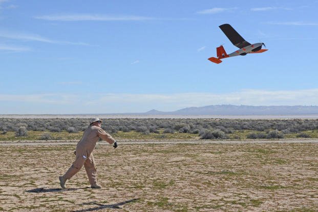 Dave Freeman, 412th Test Wing Emerging Technologies Combined Test Force, hand launches a small unmanned aircraft system at Edwards AFB, California, Feb. 27, 2019. The ET CTF conducted its first autonomy flight test Feb. 26-28. (U.S. Air Force photo/Kenji Thuloweit)