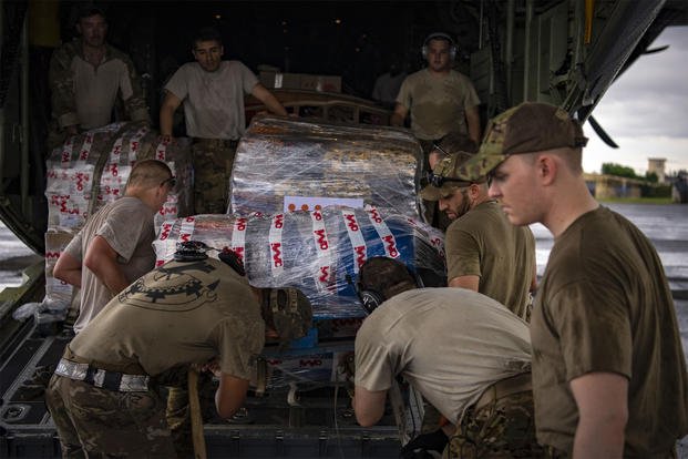 U.S. Airmen and Soldiers load relief supplies into the back of a C-130J Hercules assigned to the 75th Expeditionary Airlift Squadron, Combined Joint Task Force-Horn of Africa, at the airport in Maputo, Mozambique, March 29, 2019. (U.S. Air Force/Tech. Sgt. Chris Hibben)