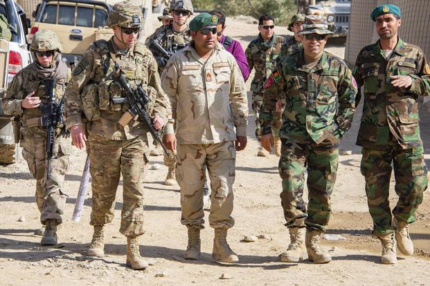 Lt. Col. Zachary Miller, center left, commander of the 1st Security Force Assistance Brigade's 5th Battalion, walks with Afghan military leaders during a clearing operation near Kabul, Afghanistan, Sept. 16, 2018. (Photo Credit: U.S. Army photo by Sean Kimmons) 