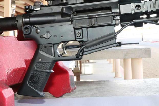 Smartshooter Inc.’s SMASH Fire Control System features a special pistol grip that only allows the weapon to fire when the shot is lined up properly. (Matthew Cox/Military.com)