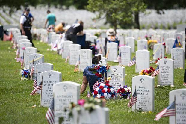 Family, friends, and loved ones visit gravesites in Section 60 of Arlington National Cemetery, Arlington, Virginia, May 27, 2019. (U.S. Army/Elizabeth Fraser)
