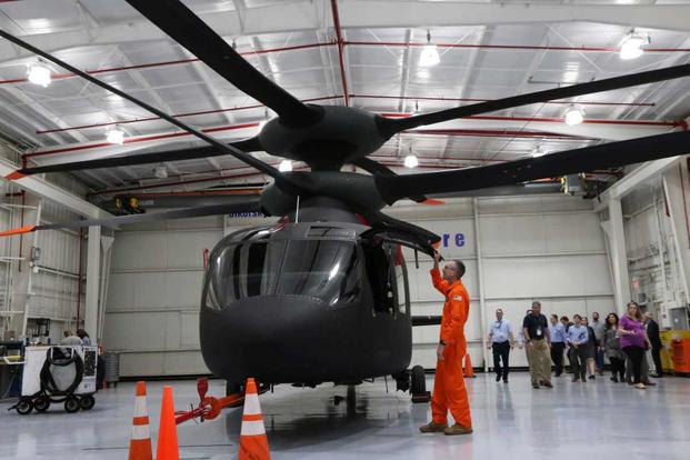 Ed Henderscheid, former U.S. Army AH-64 Apache pilot, opens door on SB-1 Defiant. 