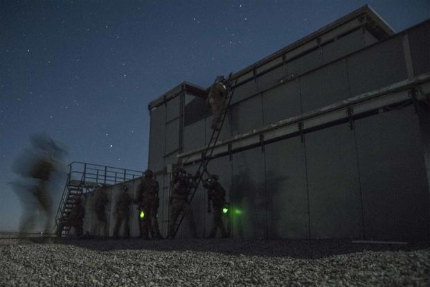 Special Tactics Airmen infiltrate a compound at Fort Bliss.