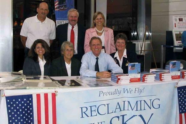Tom Murphy (seated, center) at a signing for his book, 'Reclaiming the Sky: 9/11 and the Untold Story of the Men and Women Who Kept America Flying.'
