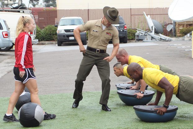 Drill instructors demonstrate exercises.