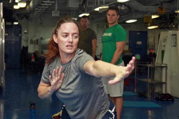 A gunnery sergeant teaches movements during a class that mixes Pilates, Tai-chi and yoga.