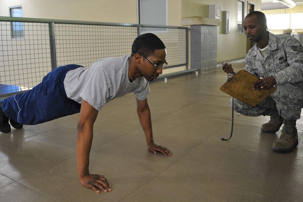 An airman does push-ups for one minute on Barksdale Air Force Base, Louisiana.