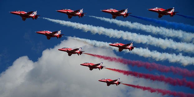 Royal Air Force Aerobic Team, The Red Arrows, fly over a crowd during the Farnborough International Airshow, England, July 14. 2014. Held every two years, Farnborough Airshow represents a unique opportunity for the U.S. and its allies to showcase their leadership in aerospace technologies. (U.S. Air Force photo by Airman 1st Class Erin O'Shea/Released) Farnborough International Airshow