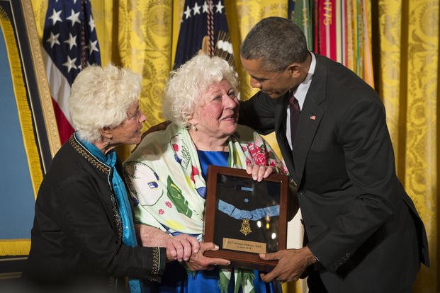 President Barack Obama bestows the Medal of Honor to Army Sgt. William Shemin -- with his daughters, Elsie Shemin-Roth (middle) and Ina Bass (left), accepting on his behalf -- in the East Room of the White House.