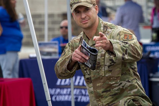 A member of the Idaho National Guard visits a job fair at Gowen Field.
