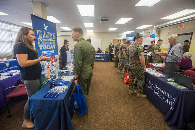 U.S. Marines and sailors receive information from various colleges to the Department of Veteran Affairs during the Personal and Professional Development Open House event at the Education Center, Marine Corps Base Hawaii.