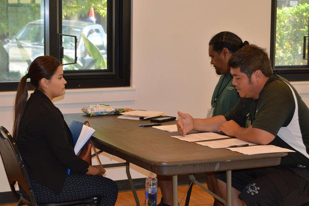 A job candidate is interviewed at the FMWR Hiring Fair at Aliamanu Military Reservation's community center.
