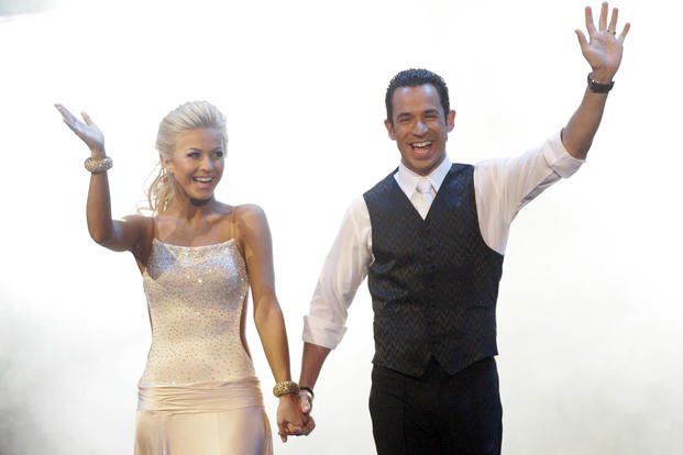 Indy Racing League driver Helio Castroneves is introduced with his dance partner, Julianne Hough, before performing as part of the ‘Dancing with the Stars’ tour in Indianapolis.