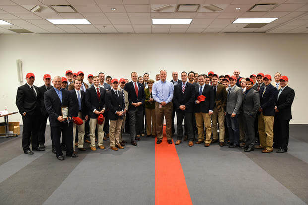 Paratroopers and Red Hat corporate executives pose for a photograph during a corporate-military engagement at the Red Hat Inc. corporate headquarters in Raleigh, N.C.