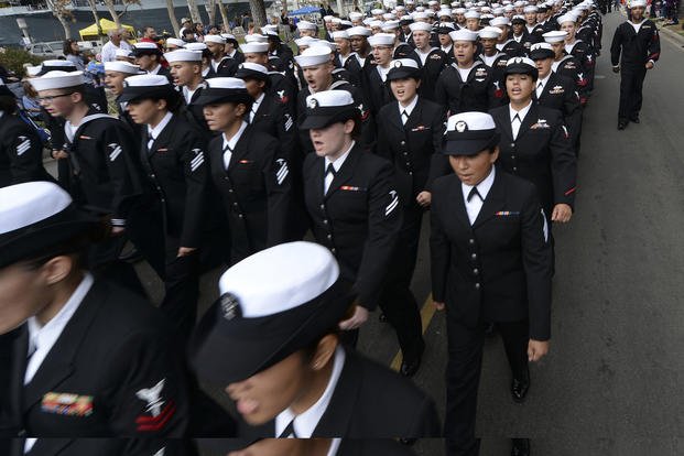 Sailors assigned to Naval Medical Center San Diego march and sing during the San Diego Veterans Day Parade.