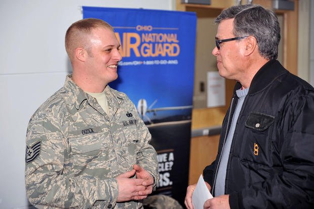 Tech. Sgt. Tyler Ogden, a recruiter for the 178th Wing, speaks with one of about 500 veterans who attended the Veterans Resource Fair at Wilmington Air Park in Wilmington, Ohio.