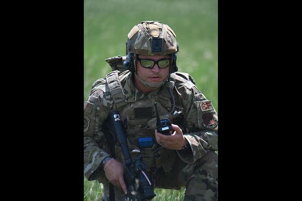 U.S. Air Force Tech. Sgt. Nicholas Van Pelt, of the 219th Security Forces Squadron, North Dakota Air National Guard, talks on a radio during a force-on-force annual training exercise scenario at the Minot Air Force Base, N.D.
