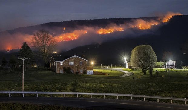 A wildfire burns along the western slope of Massanutten Mountain in Virginia.