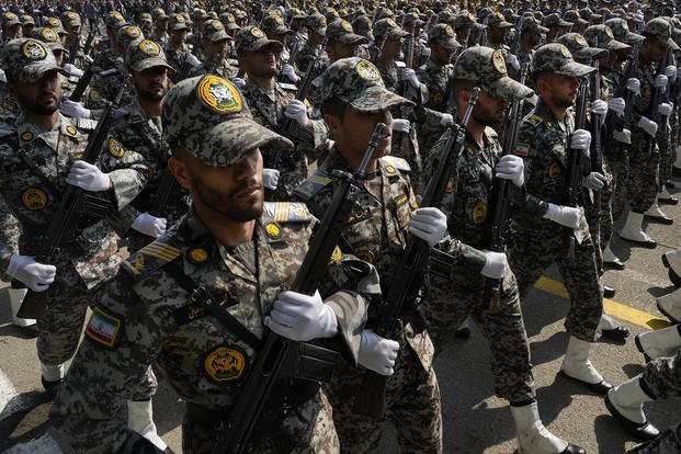 Iranian army members march during the Army Day parade at a military base in northern Tehran, Iran, Wednesday, April 17, 2024. In the parade, President Ebrahim Raisi warned that the 'tiniest invasion' by Israel would bring a 'massive and harsh' response, as the region braces for potential Israeli retaliation after Iran's attack over the weekend. 