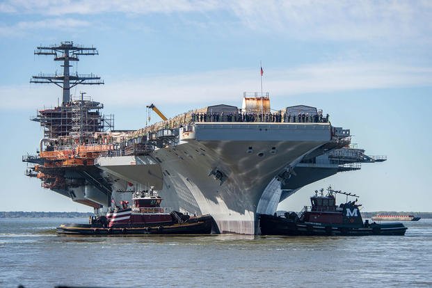Nimitz-class aircraft carrier USS John C. Stennis is moved to an outfitting berth in Newport News