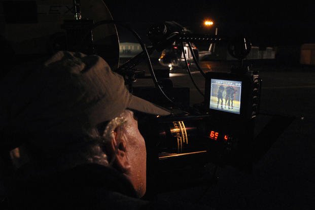 A cameraman films U.S. Navy SEALs during an episode of the Fox network television series "24" at Camarillo Airport in 2008.