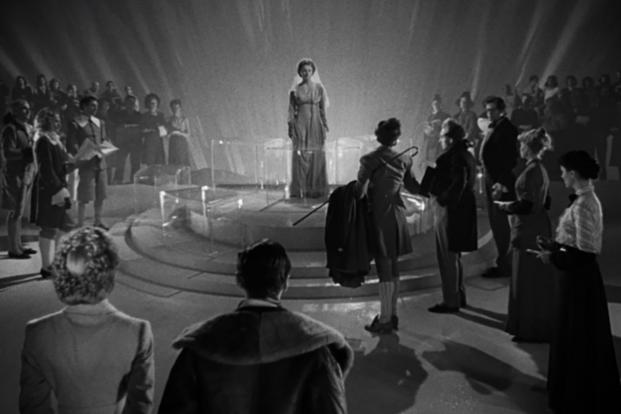 The Chief Recorder (Joan Maude) directs Conductor 71 (Marius Goring) and his subordinates on their next task with Peter (David Niven) in ‘A Matter of Life and Death.’ (Photo courtesy of IMDB.com) The Chief Recorder (Joan Maude) directs Conductor 71 (Marius Goring) and his subordinates on their next task with Peter (David Niven) in ‘A Matter of Life and Death.’