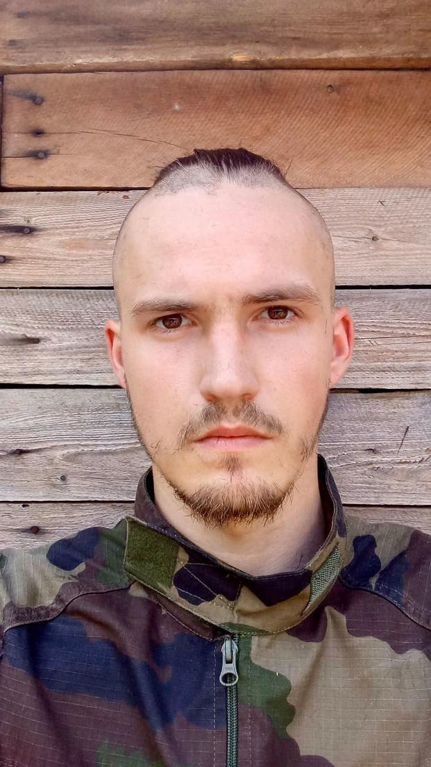 A drafted Ukrainian soldier, call sign “Zmiy," poses for a self-portrait at his base in southern Ukraine after receiving a buzz cut earlier this year. (Photo provided by Zmiy) A drafted Ukrainian soldier, call sign “Zmiy," poses for a self-portrait at his base in southern Ukraine after receiving a buzz cut earlier this year. (Photo provided by Zmiy)