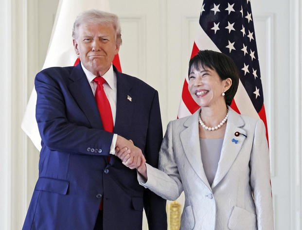 President Donald Trump, left, and Japanese Prime Minister Sanae Takaichi shake hands before their summit talk at Akasaka Palace in Tokyo, Tuesday, Oct. 28, 2025. (Kyodo News via AP) Japan Trump Asia