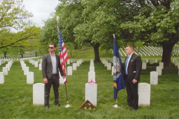 Relatives of the late Charles R. Trescott stand at Arlington National Cemetery, Va., near his new gravestone that lists the Silver Star awarded for his heroic actions on May 3, 1966, in Quang Tin Province in South Vietnam. (Photo courtesy Bill Ivory)