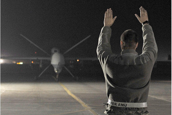 An MQ-9 Reaper returns from a mission on Dec. 1, 2010, at Kandahar Airfield in Afghanistan. (Air Force/Chad Chisholm)
