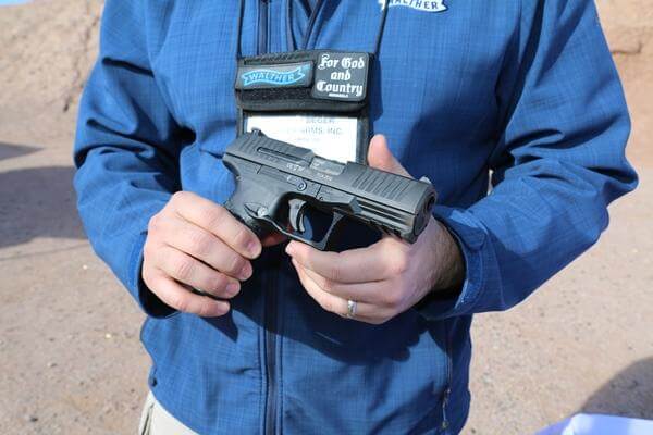 Everett Deger, marketing director with Walther Arms, highlights the company's first-ever .45-caliber pistol, the PPQ 45, at SHOT Show in Las Vegas, Jan. 18, 2016. (Photo by Brendan McGarry/Military.com.)
