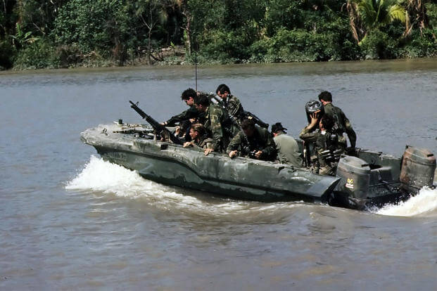 Republic of Vietnam...Members of U.S. Navy Seal Team One move down the Bassac River in a Seal team Assault Boat (STAB) during operations along the river south of Saigon., 11/1967 (Photo: National Archives)