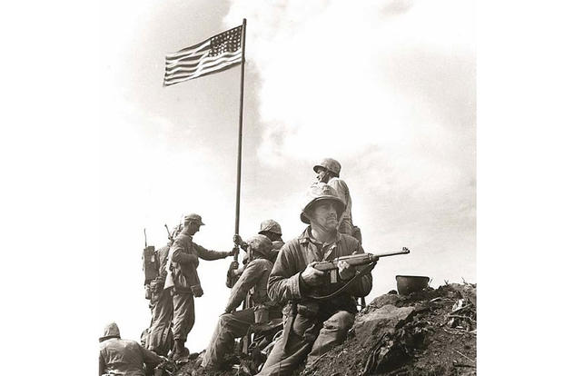 The Marine Corps is updating its historical records to identify who participated in the first flag-raising atop Mount Suribachi during World War II. Photo by Staff Sgt. Lou Lowery. Courtesy Marine Corps History Division