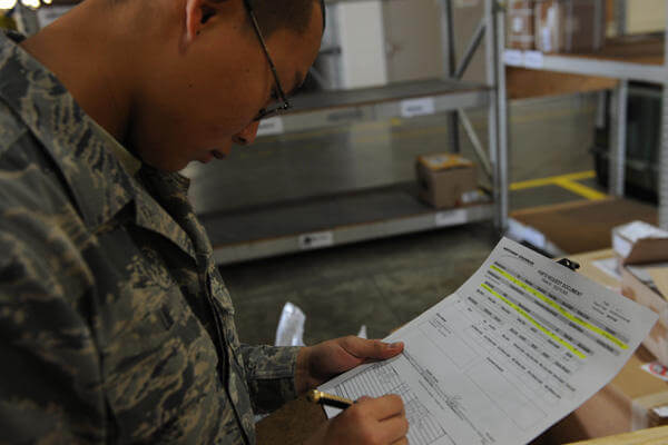 A Soldier looks over some paperwork.