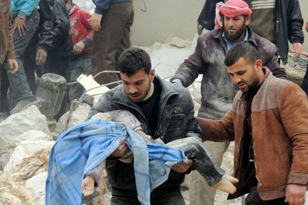 This citizen journalism image taken on Tuesday, Feb. 19, 2013 and provided by Aleppo Media Center AMC, shows a Syrian man carrying a girl's body in the aftermath of a strike by Syrian government, in the neighborhood of Jabal Bedro, in Aleppo, Syria.