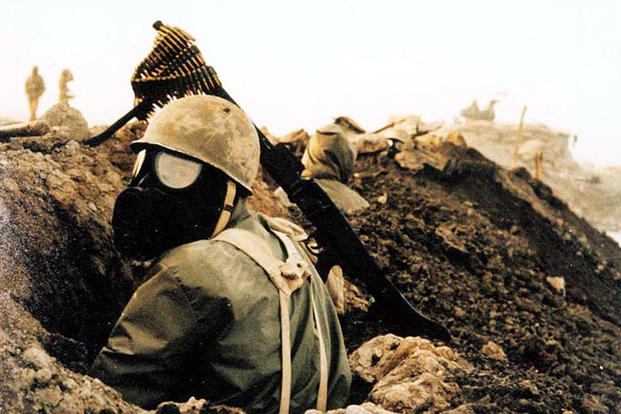 Iranian soldier with gas mask during Iraq-Iran Civil War. Photo courtesy of Joseph V. Micallef