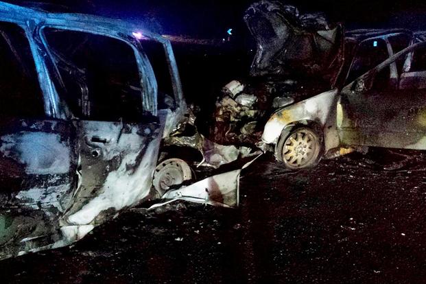 What is left of two cars after an accident on May 12, 2014, near Royal Air Force Mildenhall, England. Ssgt Vicente Gomez performed life-saving assistance to the crash victims. Gomez was presented with the Airman’s Medal for his acts. (Courtesy photo)