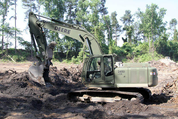 A U.S. Soldier in the 1782nd Engineer Company, South Carolina Army National Guard, operates an excavator while conducting annual training at the Savannah River Site in Aiken, South Carolina, June 13, 2016. (U.S. Army/Sgt. Brad Mincey)
