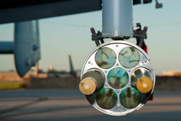 M151 warhead rounds integrated with the Advanced Precision Kill Weapon System II are loaded on an A-10 ahead of a test mission on Eglin Air Force Base, Fla. (Air Force Photo)