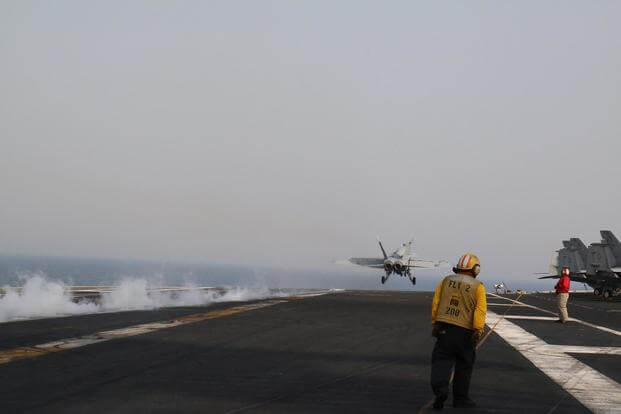 An F/A-18 Hornet completes a catapult launch from the deck of the carrier George H.W. Bush in the Middle East. Twice since the carrier deployed in January, pilots have experienced hypoxia-like episodes in the cockpit. Hope Hodge Seck/Military.com