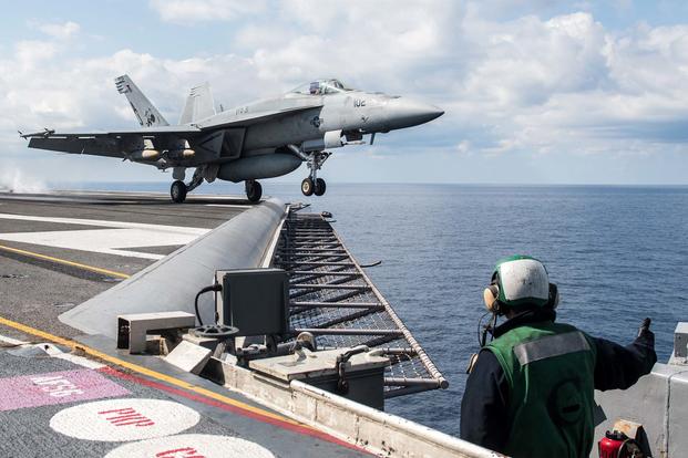FILE -- An F/A-18E Super Hornet launches from the carrier USS George H.W. Bush (CVN 77) to perform strike operations in support of Operation Inherent Resolve. (U.S. Navy/Mass Communication Specialist 3rd Class Christopher Gaines)