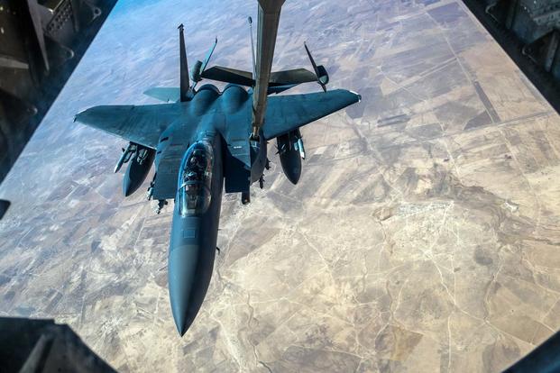 An F-15E Strike Eagle receives fuel from a KC-10 Extender with the 908th Expeditionary Air Refueling Squadron July 19, 2017, over an undisclosed location. (U.S. Air Force/Senior Airman Preston Webb)