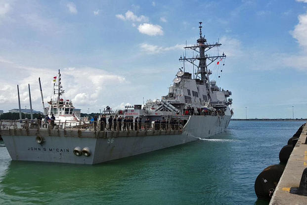 Guided-missile destroyer USS John S. McCain arrives pier side at Changi Naval Base, Republic of Singapore following a collision with a merchant vessel while underway east of the Straits of Malacca and Singapore on Aug. 21, 2017. (U.S. Navy/Joshua Fulton)